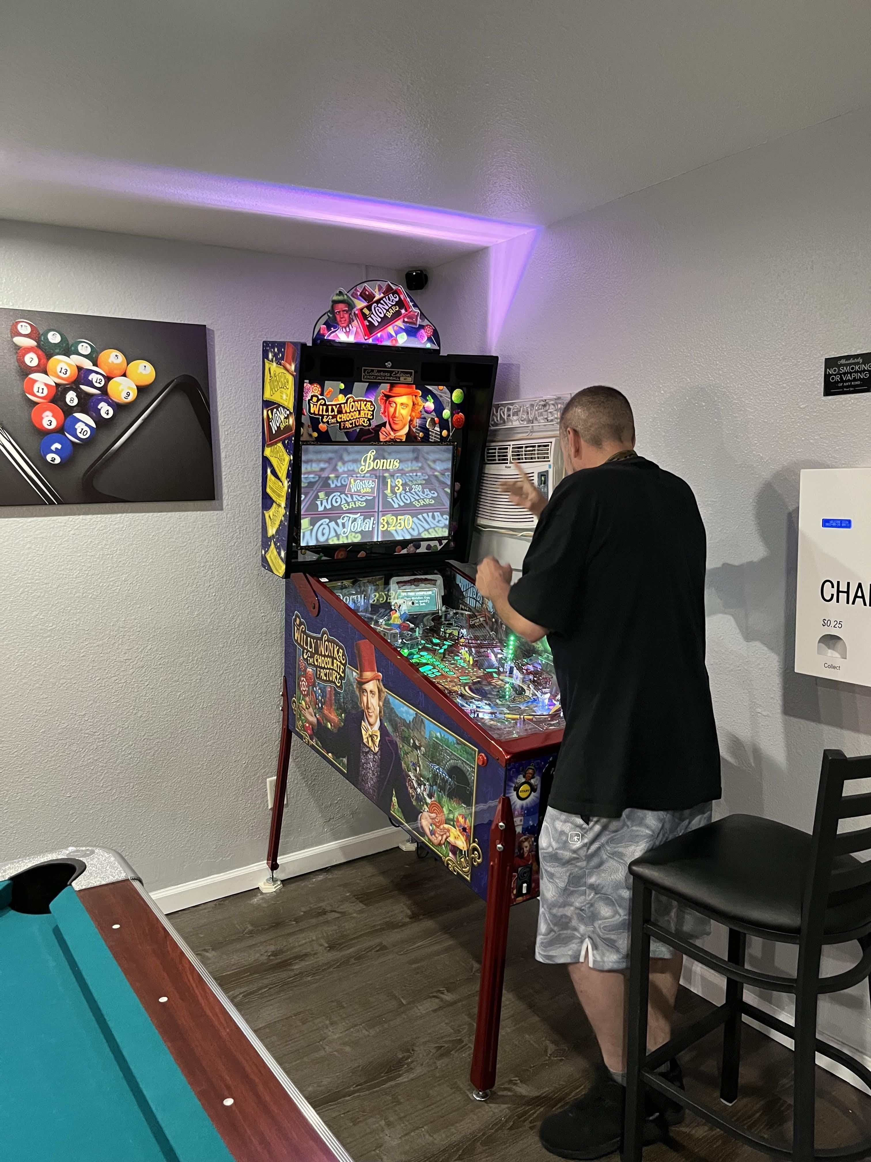 Man Enjoying Pinball Game